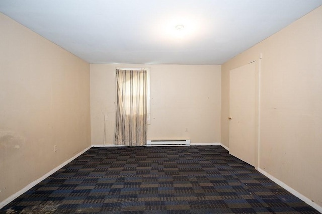 135 Elm St, Southbridge, MA 01550 - spare room with a baseboard heating unit and carpet
