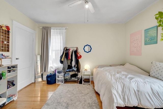 bedroom with wood finished floors and ceiling fan
