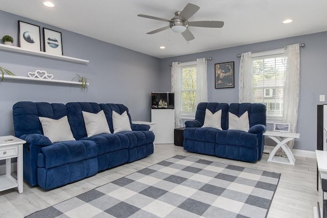living area featuring ceiling fan, recessed lighting, and light wood-style floors