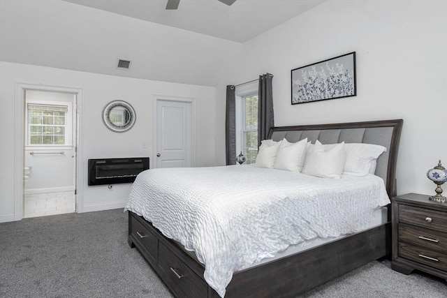 bedroom with carpet, ensuite bath, baseboards, and ceiling fan