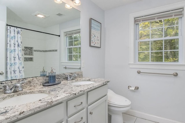 full bathroom featuring toilet, tile patterned floors, double vanity, and a shower with shower curtain