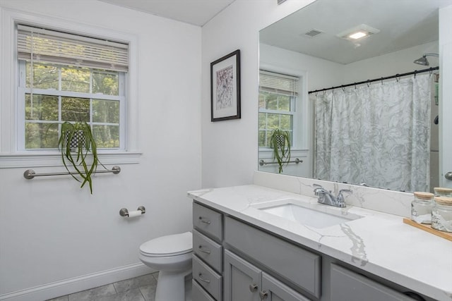 full bath with toilet, baseboards, vanity, a shower with shower curtain, and tile patterned flooring