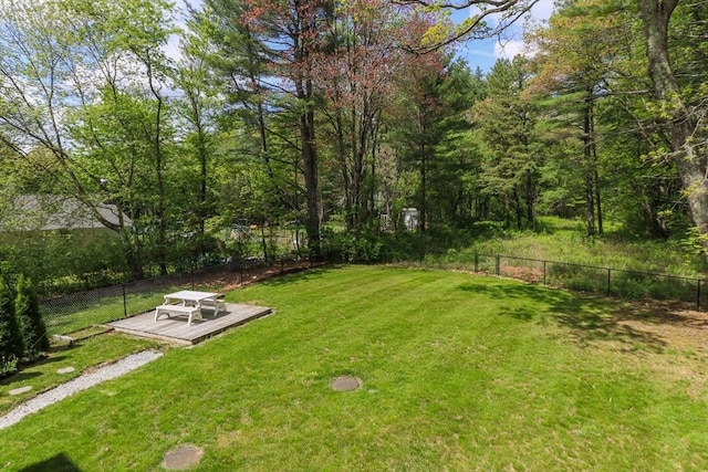 view of yard featuring a wooden deck
