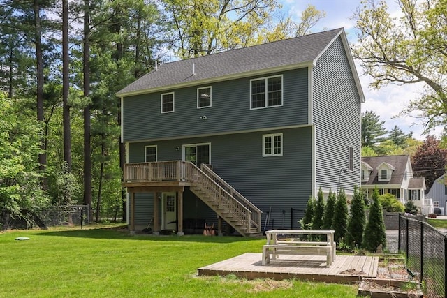 rear view of house with a deck and stairs