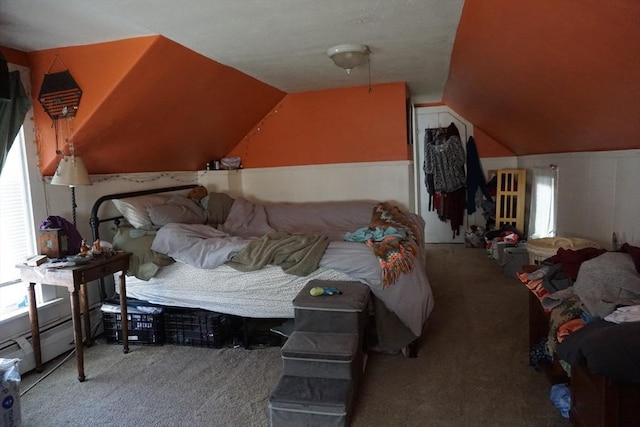 bedroom featuring carpet flooring, lofted ceiling, and baseboard heating