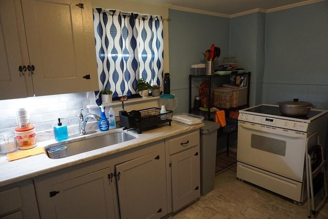 kitchen with white electric stove, a sink, crown molding, light countertops, and white cabinets