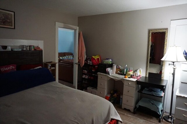 bedroom with light wood-style flooring