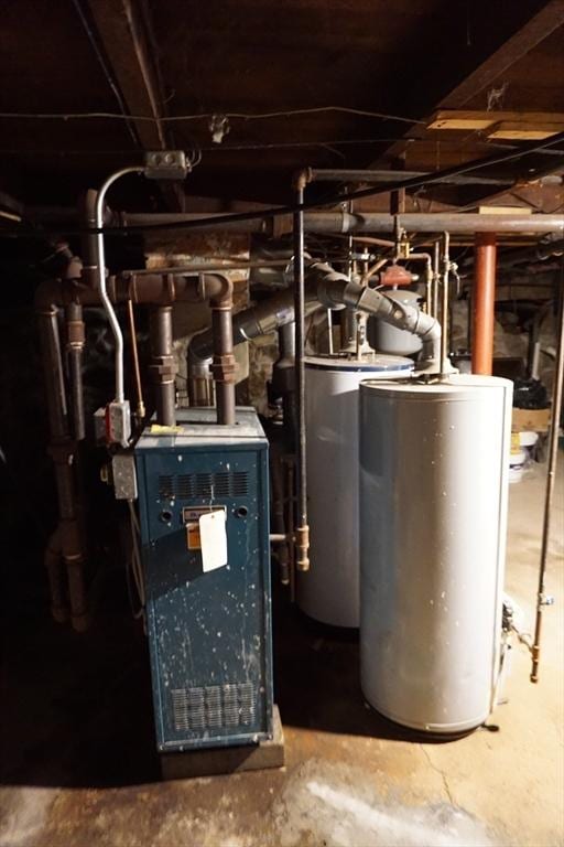 utility room featuring water heater
