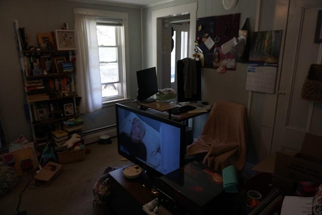 office featuring healthy amount of natural light and a baseboard heating unit