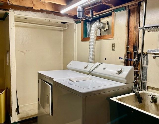 laundry room featuring washing machine and clothes dryer