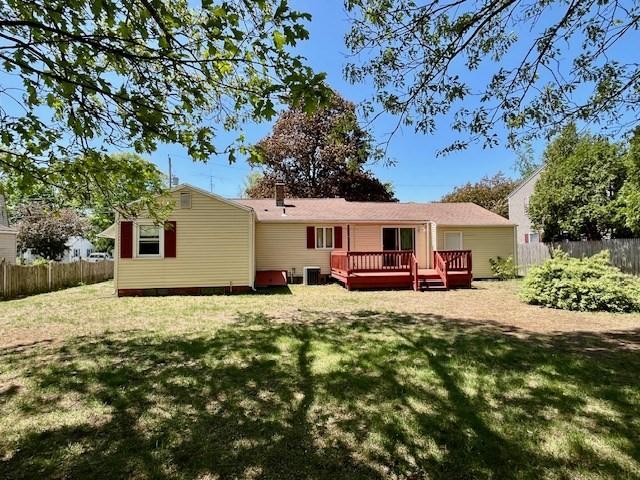 back of house featuring central AC and a wooden deck