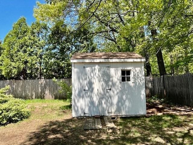 view of shed featuring a fenced backyard