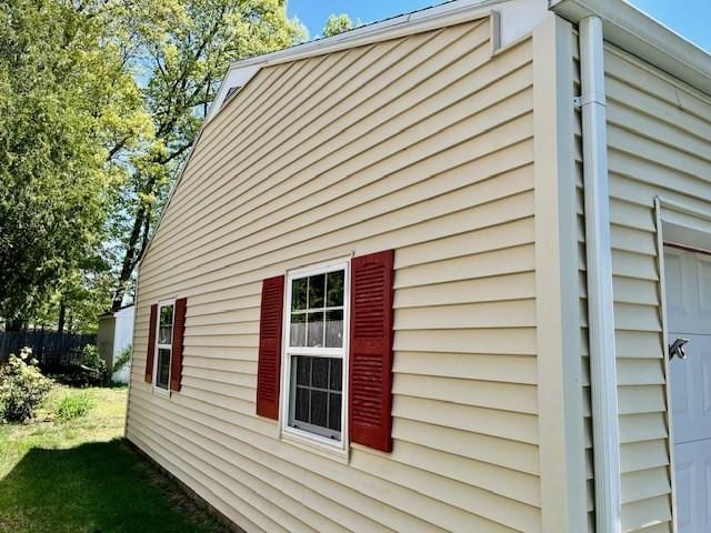 view of side of property with fence
