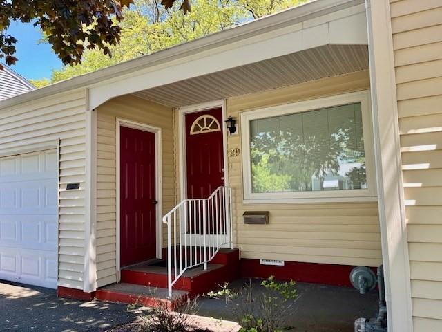 doorway to property featuring a garage