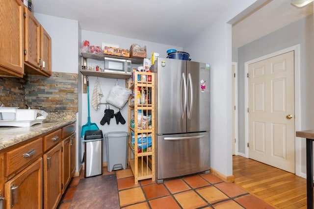 5 Linda Ln Unit 2-2, Boston, MA 02125 - kitchen featuring freestanding refrigerator, tasteful backsplash, and brown cabinetry