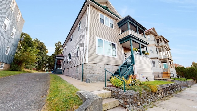 view of front of property with a balcony