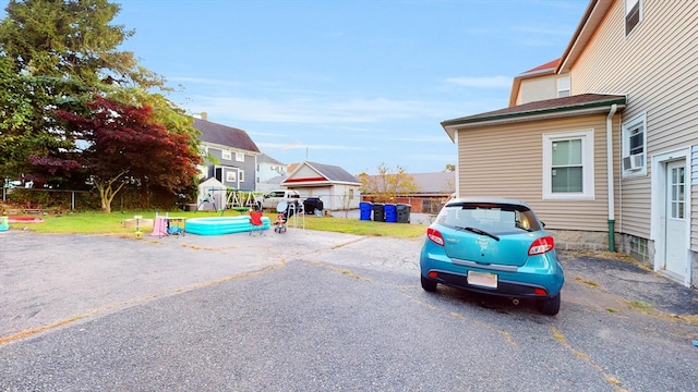 exterior space with a lawn and cooling unit