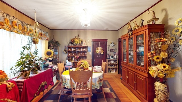 dining area featuring crown molding and wood-type flooring