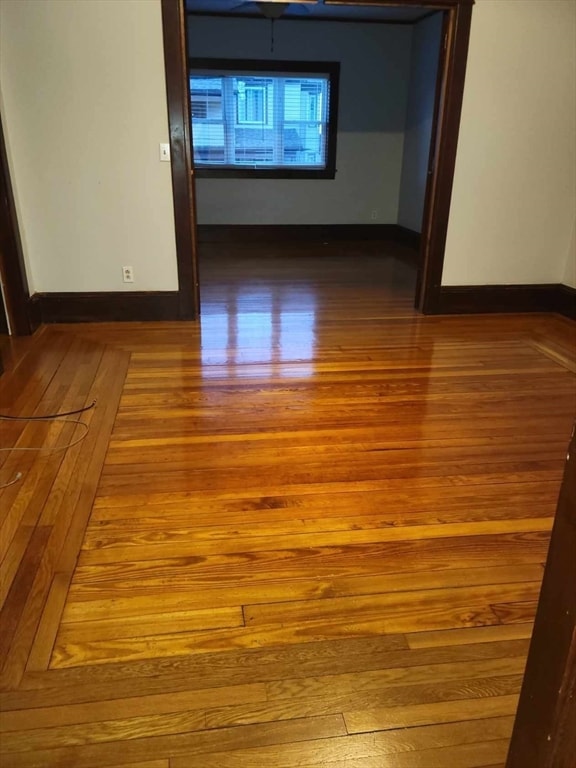 unfurnished room with hardwood / wood-style floors