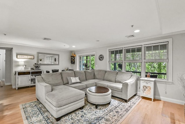 29 Maple St Unit C, Canton, MA 02021 - living room featuring light wood-style flooring, ornamental molding, and recessed lighting