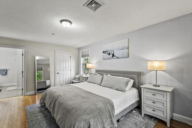 29 Maple St Unit C, Canton, MA 02021 - bedroom with wood-type flooring, multiple windows, and a closet