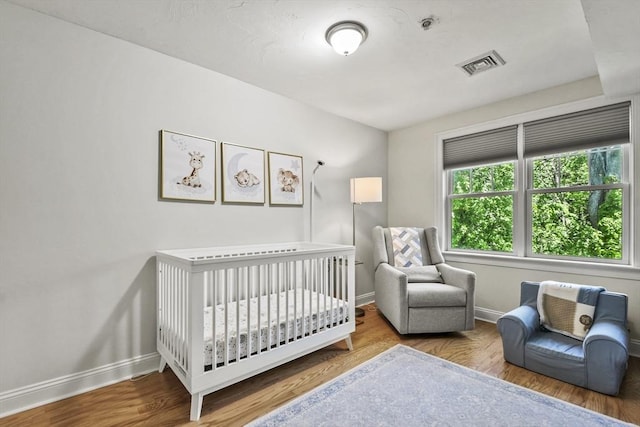 29 Maple St Unit C, Canton, MA 02021 - bedroom with a nursery area and wood finished floors