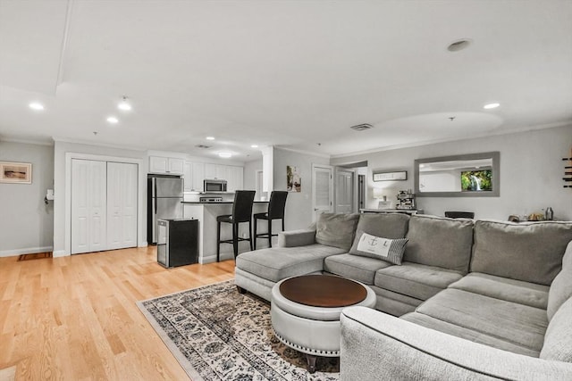 29 Maple St Unit C, Canton, MA 02021 - living area with ornamental molding, recessed lighting, and light wood finished floors