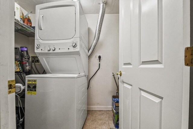 29 Maple St Unit C, Canton, MA 02021 - laundry room with stacked washer and clothes dryer and baseboards