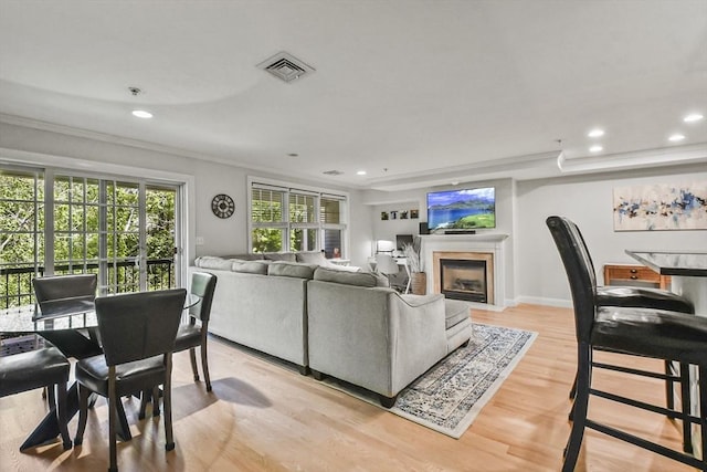 29 Maple St Unit C, Canton, MA 02021 - living area featuring ornamental molding, a fireplace with flush hearth, recessed lighting, and light wood-style floors