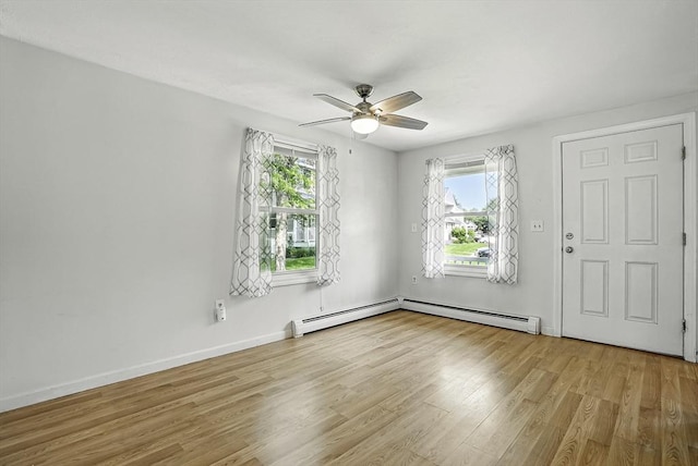 205 Bayberry Hill Ln Unit 205, Leominster, MA 01453 - entrance foyer with plenty of natural light, wood finished floors, ceiling fan, and a baseboard radiator