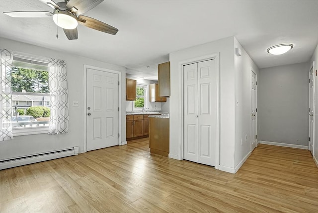 205 Bayberry Hill Ln Unit 205, Leominster, MA 01453 - foyer entrance with light wood-style flooring, a ceiling fan, and baseboard heating