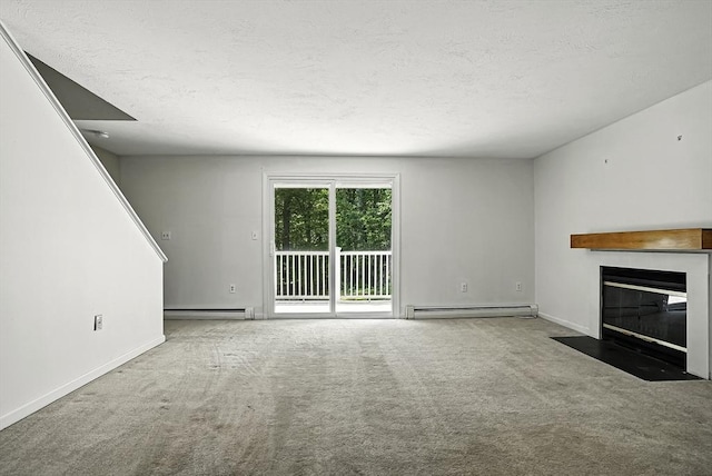 205 Bayberry Hill Ln Unit 205, Leominster, MA 01453 - unfurnished living room with a baseboard radiator, carpet flooring, a fireplace with flush hearth, and a textured ceiling