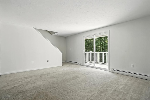 205 Bayberry Hill Ln Unit 205, Leominster, MA 01453 - carpeted spare room featuring a baseboard radiator, stairway, and a textured ceiling