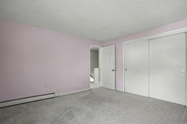 205 Bayberry Hill Ln Unit 205, Leominster, MA 01453 - unfurnished bedroom featuring carpet flooring, a closet, and baseboard heating