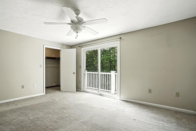 205 Bayberry Hill Ln Unit 205, Leominster, MA 01453 - unfurnished bedroom featuring access to exterior, carpet, a ceiling fan, a closet, and a textured ceiling