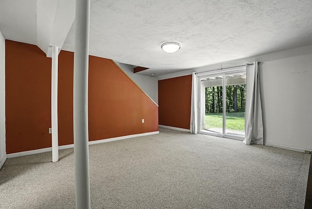205 Bayberry Hill Ln Unit 205, Leominster, MA 01453 - below grade area featuring carpet and a textured ceiling