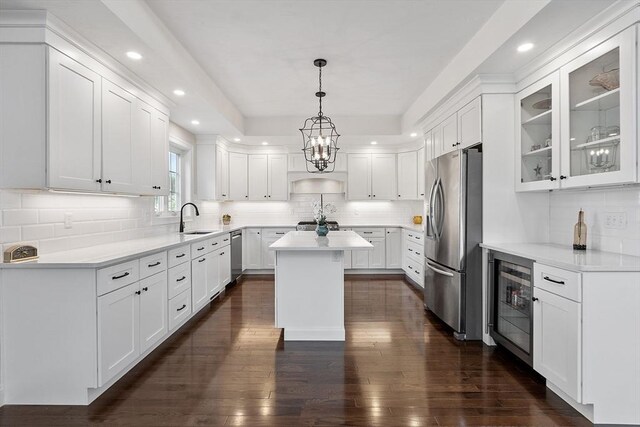 16 Dean Ln Unit 16, Littleton, MA 01460 - kitchen with stainless steel appliances, beverage cooler, a sink, decorative backsplash, and recessed lighting