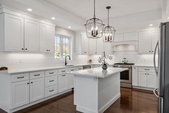 16 Dean Ln Unit 16, Littleton, MA 01460 - kitchen with appliances with stainless steel finishes, a sink, dark wood-style flooring, white cabinetry, and recessed lighting