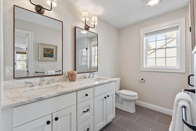 16 Dean Ln Unit 16, Littleton, MA 01460 - bathroom with tile patterned flooring, baseboards, toilet, and double vanity