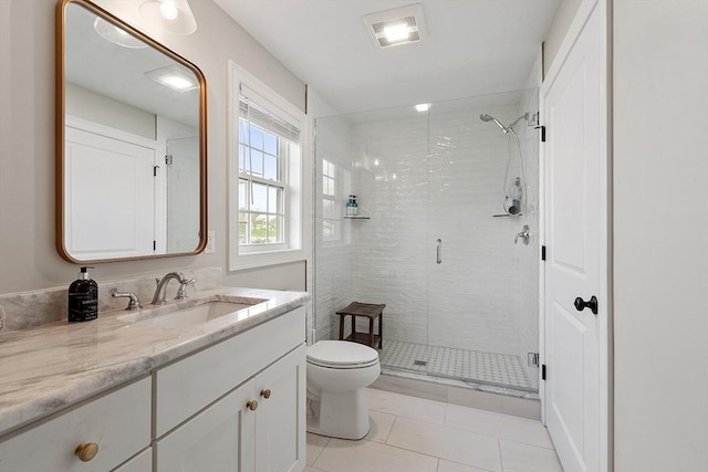 16 Dean Ln Unit 16, Littleton, MA 01460 - full bath with a stall shower, toilet, vanity, and tile patterned flooring