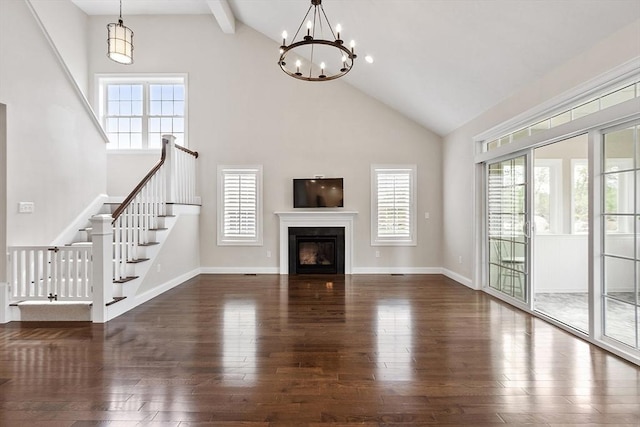 16 Dean Ln Unit 16, Littleton, MA 01460 - unfurnished living room featuring high vaulted ceiling, plenty of natural light, hardwood / wood-style flooring, stairway, and beamed ceiling