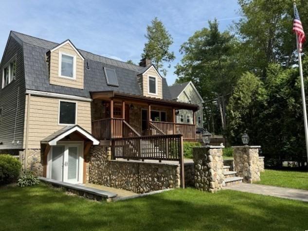 80 Populatic St, Franklin, MA 02038 - rear view of house with covered porch, a lawn, and stone siding