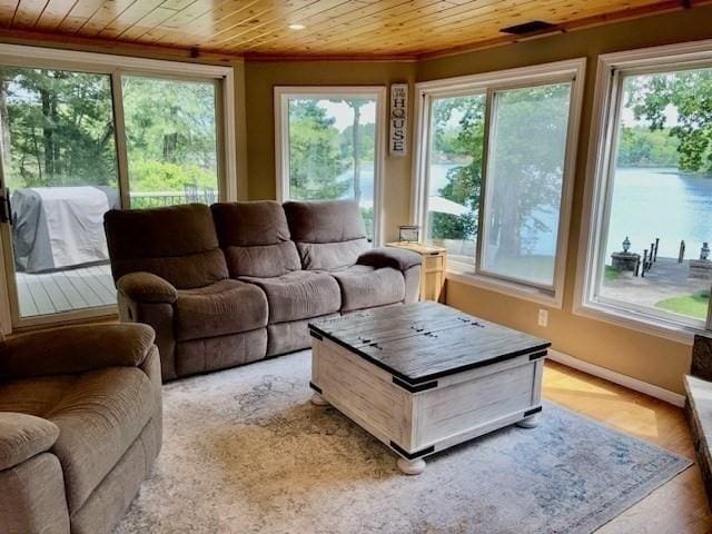 80 Populatic St, Franklin, MA 02038 - living room featuring crown molding, plenty of natural light, wooden ceiling, light wood-type flooring, and baseboards