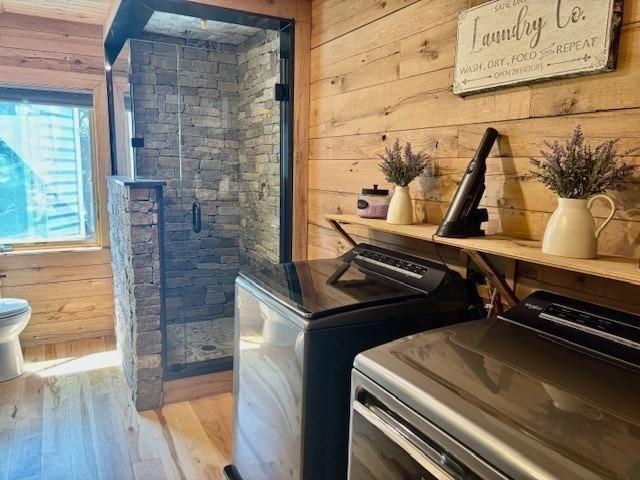 80 Populatic St, Franklin, MA 02038 - laundry room featuring wooden walls, washer and clothes dryer, and wood finished floors