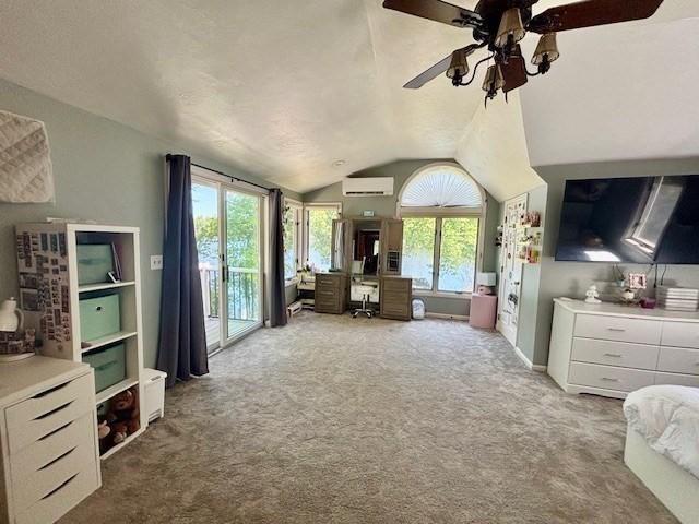 80 Populatic St, Franklin, MA 02038 - carpeted bedroom featuring access to exterior, multiple windows, vaulted ceiling, a wall unit AC, and an office area