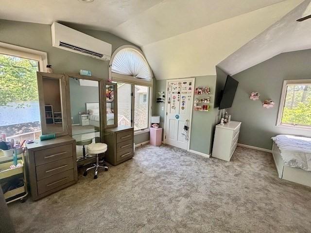 80 Populatic St, Franklin, MA 02038 - home office featuring a wall unit AC, vaulted ceiling, carpet floors, and baseboards