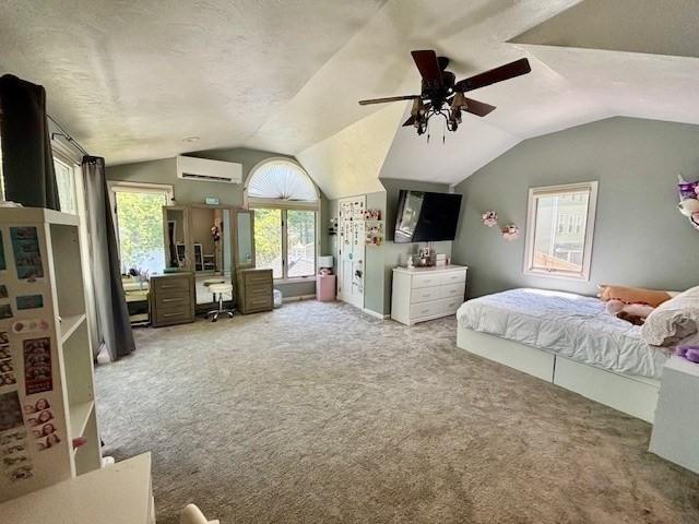 80 Populatic St, Franklin, MA 02038 - carpeted bedroom with a wall mounted AC, vaulted ceiling, an office area, and ceiling fan