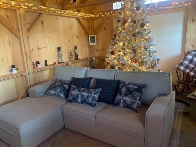 80 Populatic St, Franklin, MA 02038 - living area with wooden walls and beamed ceiling