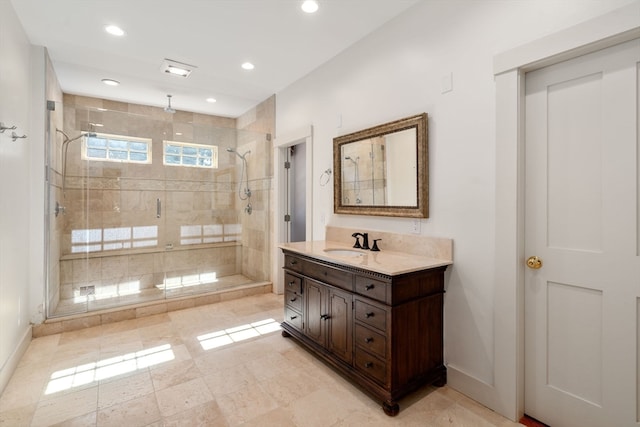 bathroom with an enclosed shower and vanity