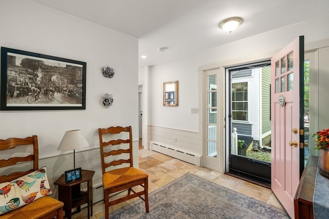 interior space featuring plenty of natural light and a baseboard radiator